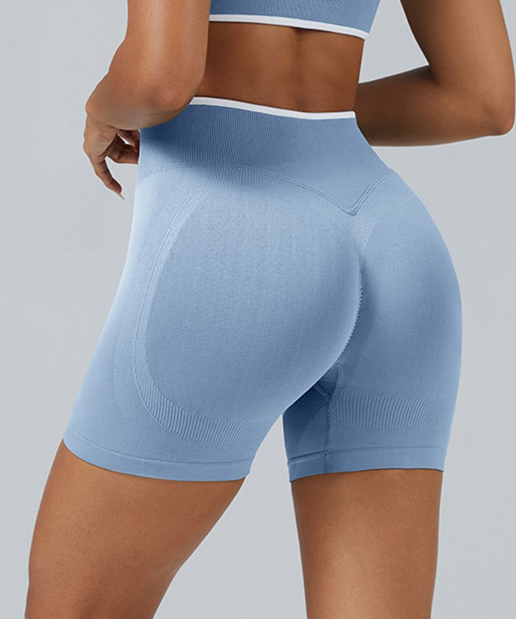 Close-up of seamless sculpting knit on fitness shorts with reinforced four-needle six-thread construction.